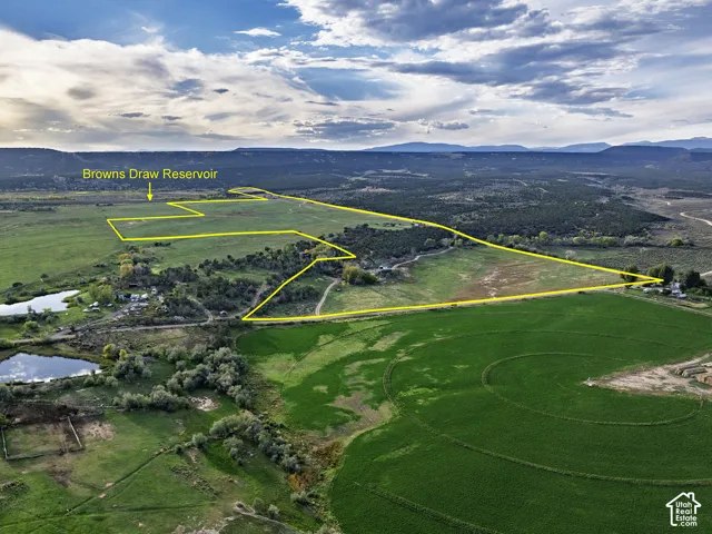 Expansive land parcel featuring Browns Draw Reservoir, agricultural fields, and natural terrain