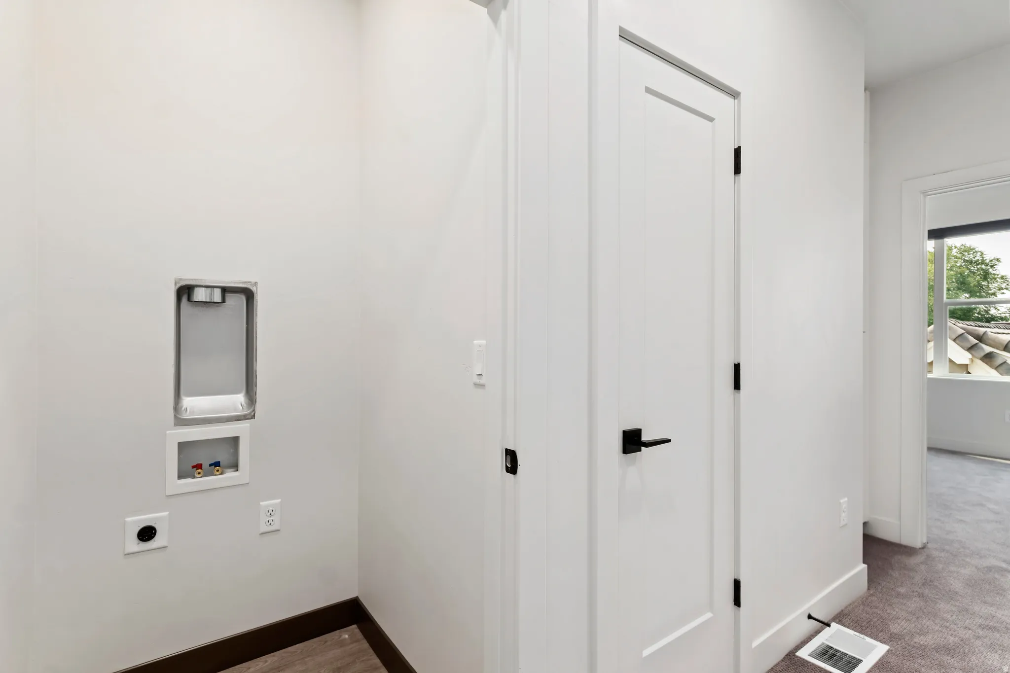 Washroom featuring electric dryer hookup and hookup for a washing machine