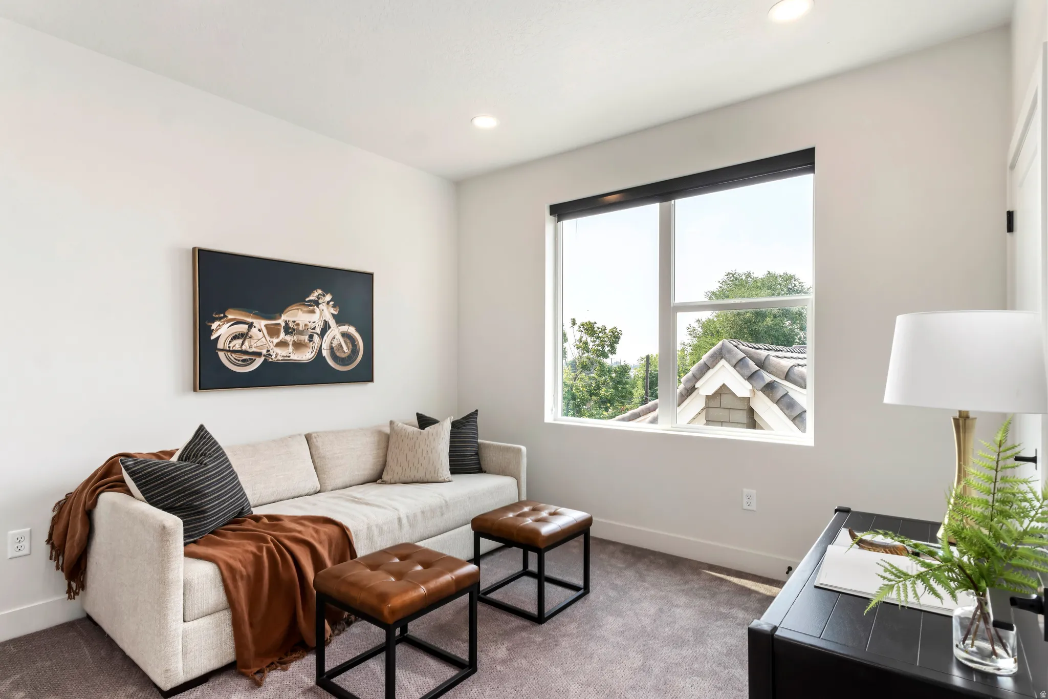 Carpeted living room with recessed lighting Model Home