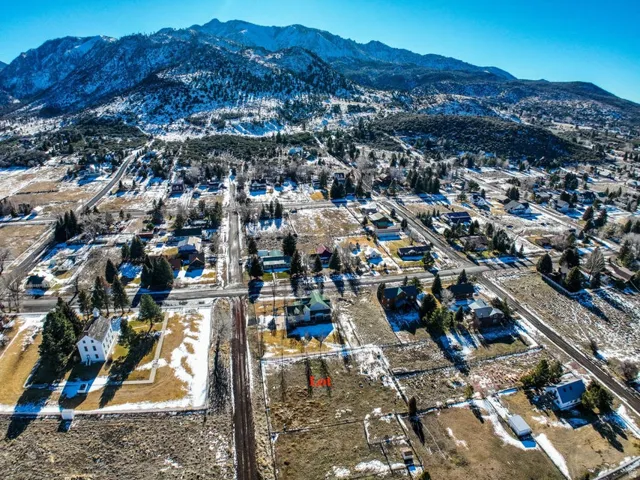 Snowy aerial view featuring a mountain view