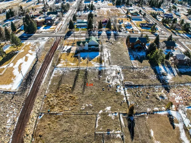 Aerial overview of property's location featuring nearby suburban area