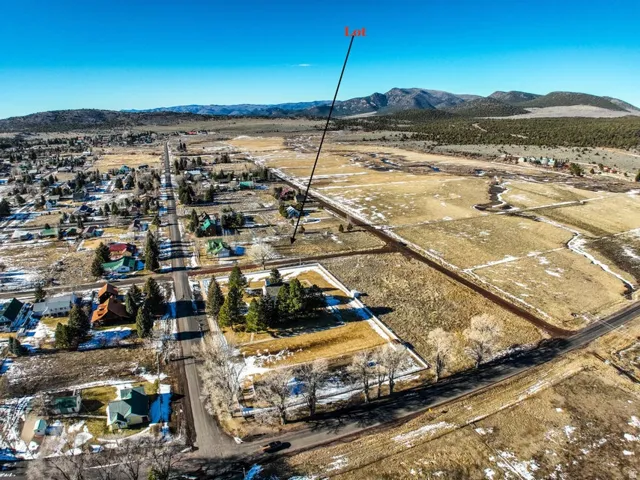 View of property location featuring a mountainous background and nearby suburban area