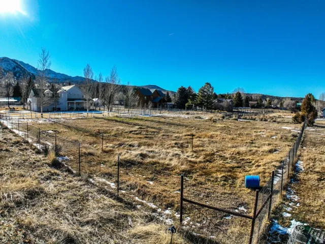 View of yard featuring a rural view and a mountain view