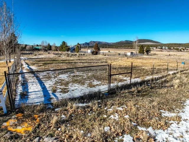 View of yard featuring a view of countryside and a mountain view