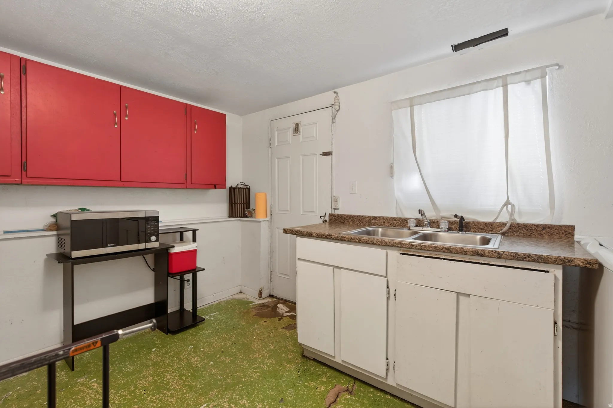 Downstairs Kitchen with stainless steel microwave