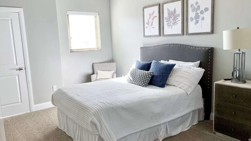 Carpeted bedroom with baseboards
