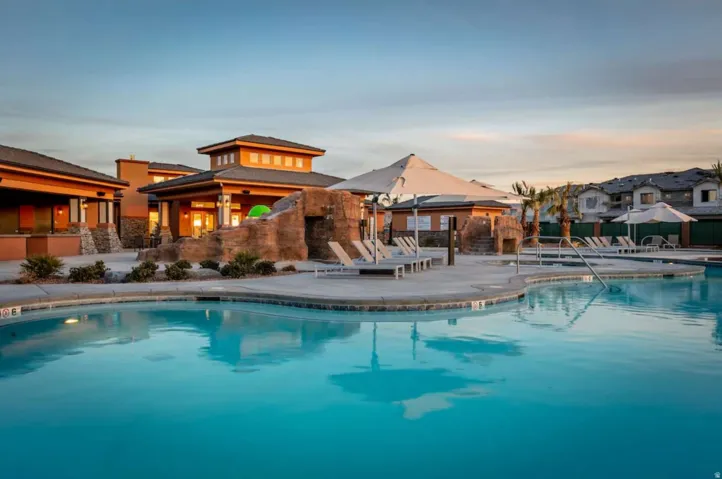 Community pool with a patio