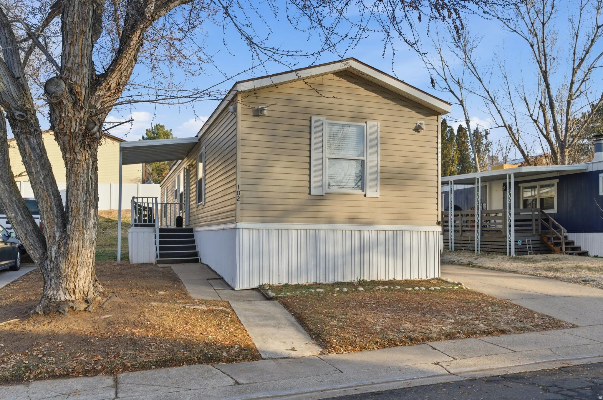 View of front of house featuring stairs and a porch