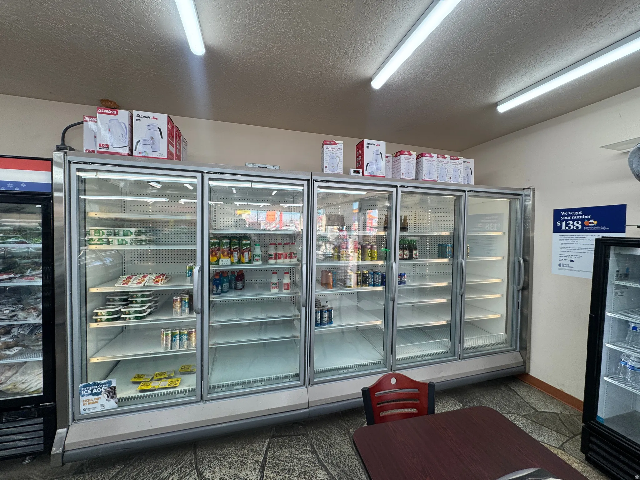 Miscellaneous room featuring a textured ceiling and beverage cooler