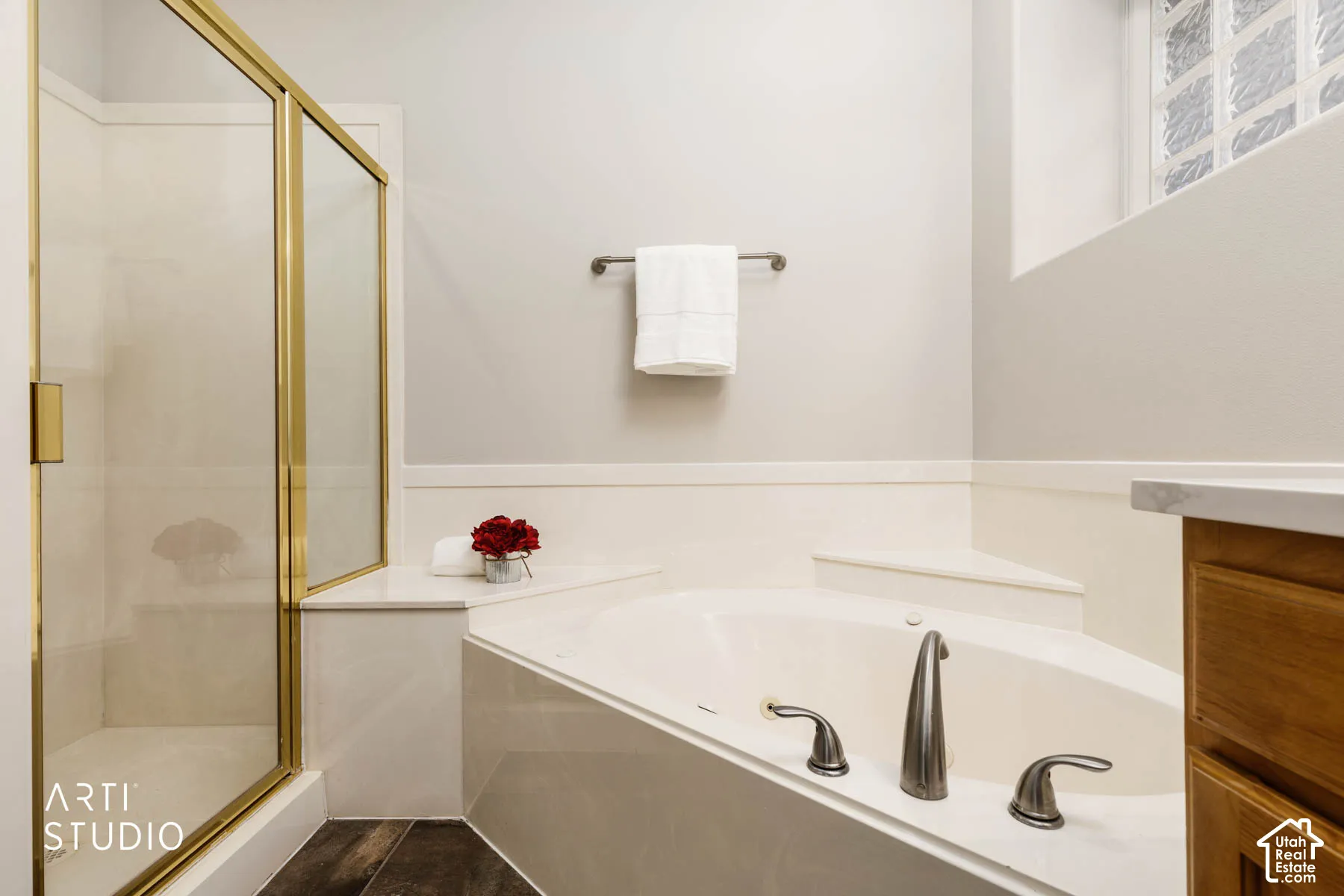 Full bath with a shower stall and a bath
