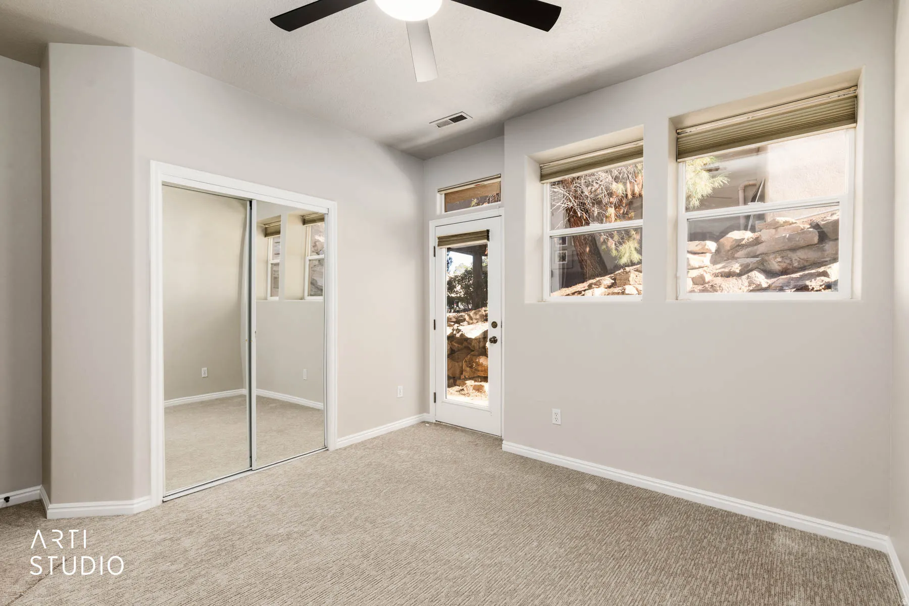 Unfurnished bedroom featuring a closet, carpet floors, and ceiling fan