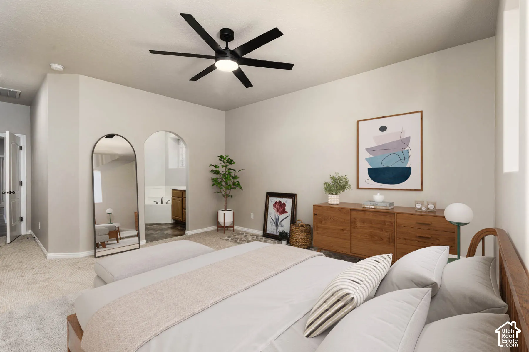 VIRTUALLY staged. Bedroom featuring carpet flooring, a ceiling fan, and ensuite bathroom