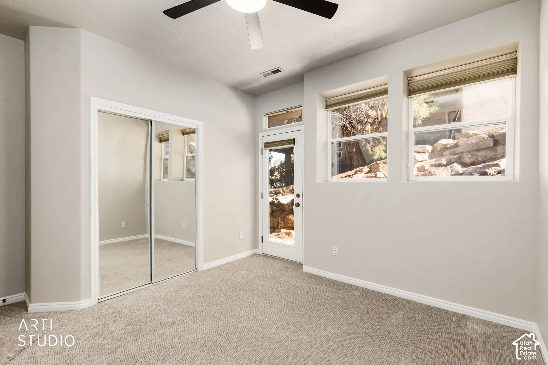 Unfurnished bedroom featuring a closet, carpet floors, and ceiling fan