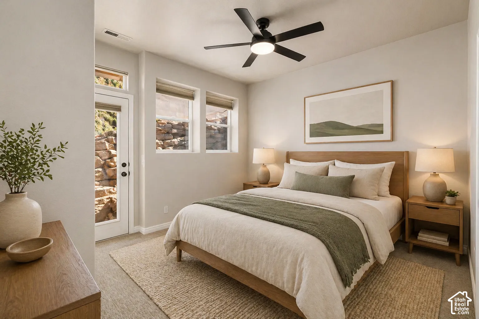 VIRTUALLY staged. Bedroom with access to outside, light carpet, ceiling fan, and multiple windows