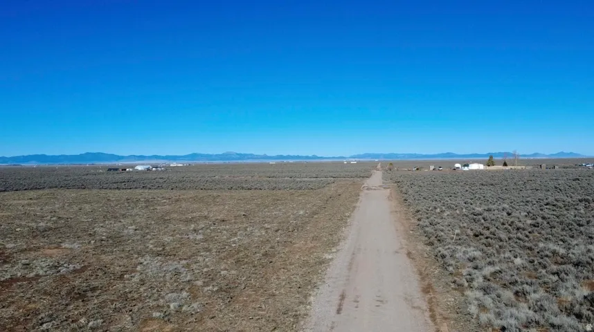 View of dirt / gravel road featuring a mountain view