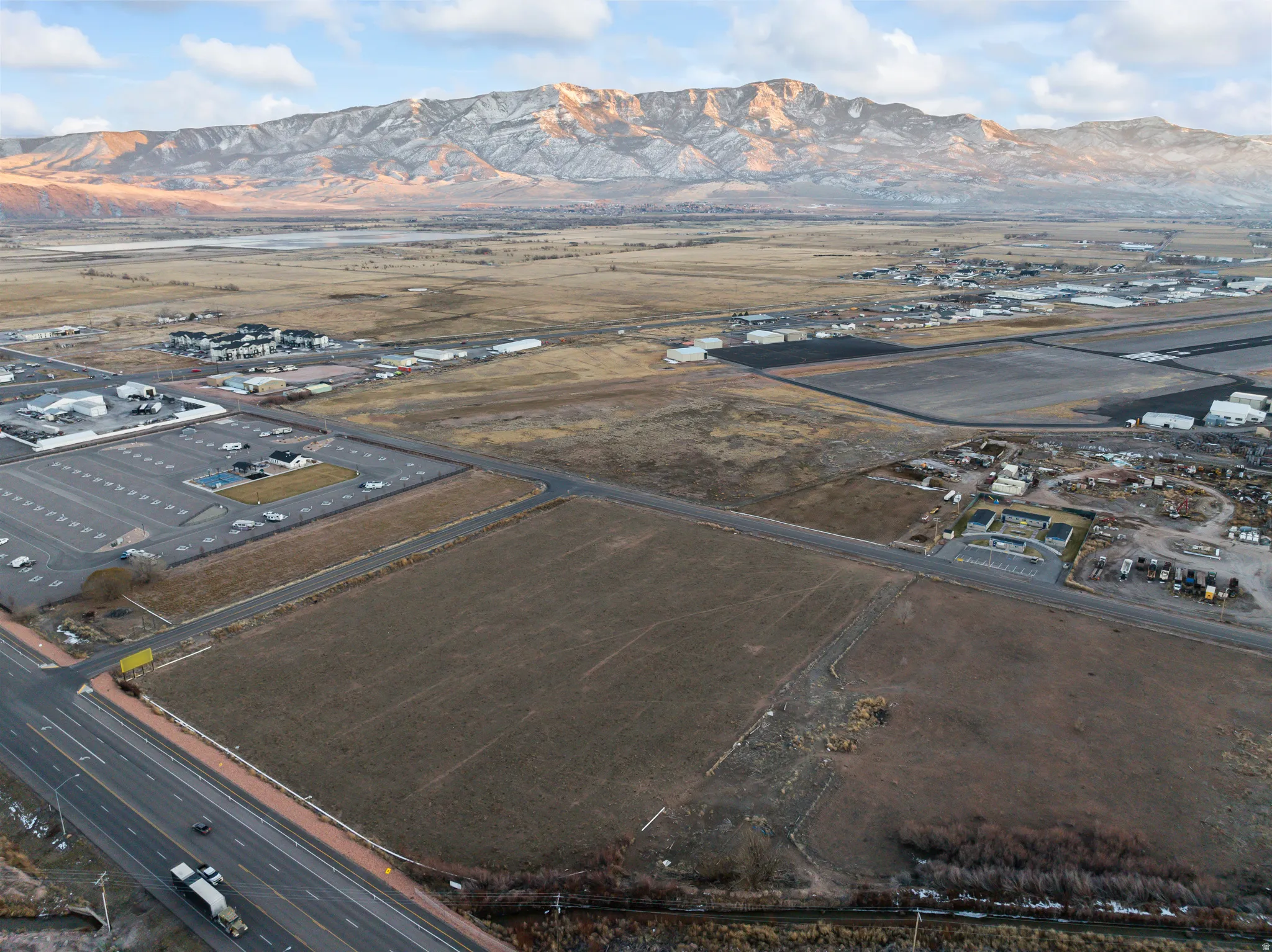 Aerial overview of property's location with a mountain backdrop