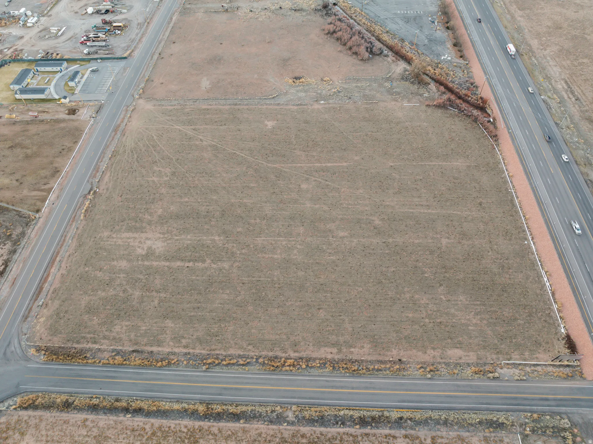 Aerial view of property and surrounding area featuring rural landscape