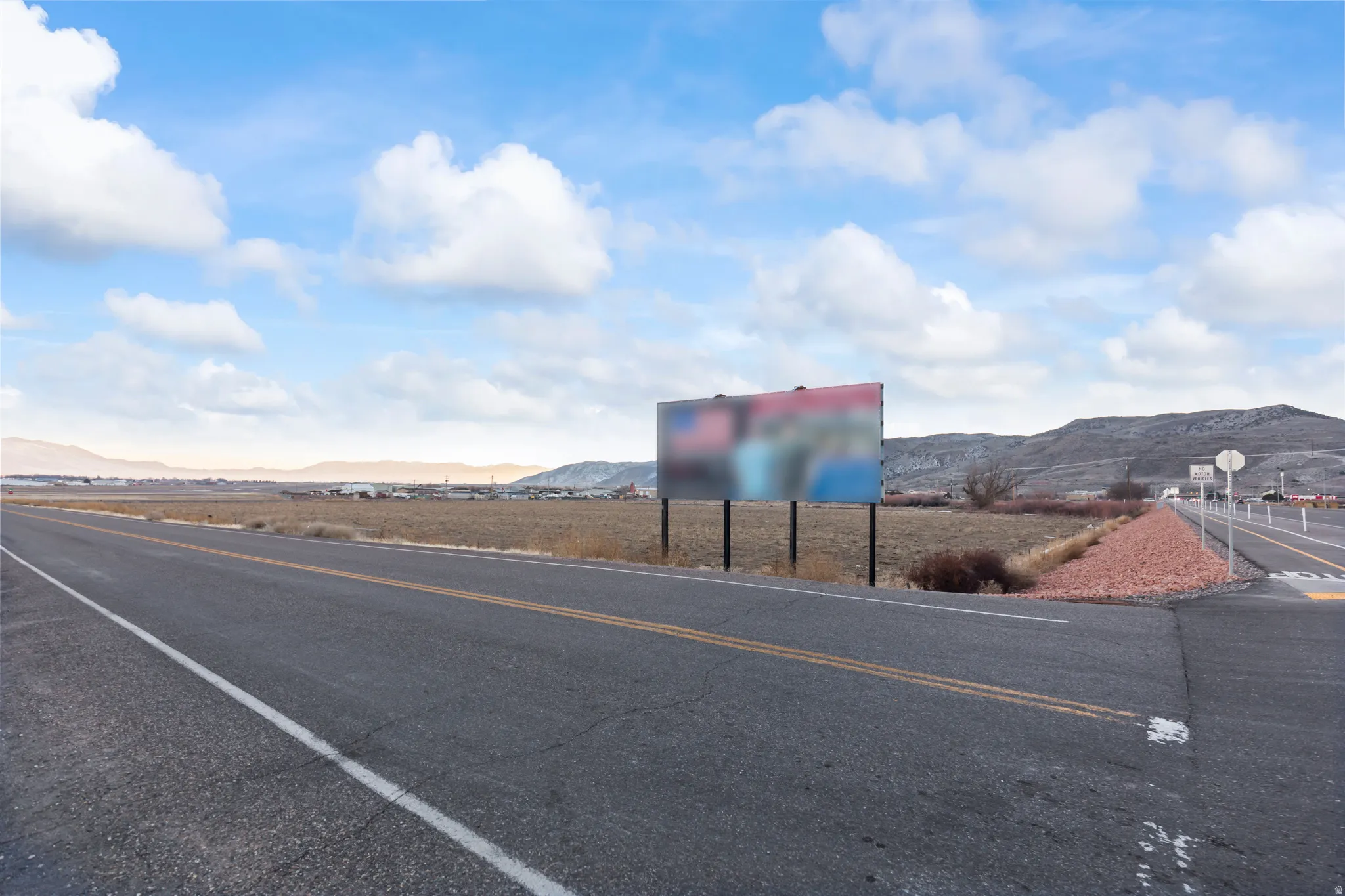 View of asphalt road featuring a mountain view