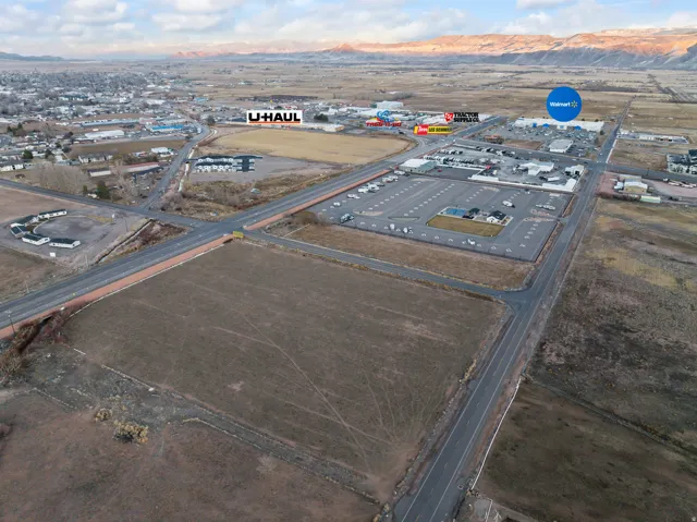 Drone / aerial view of a mountainous background and an industrial area