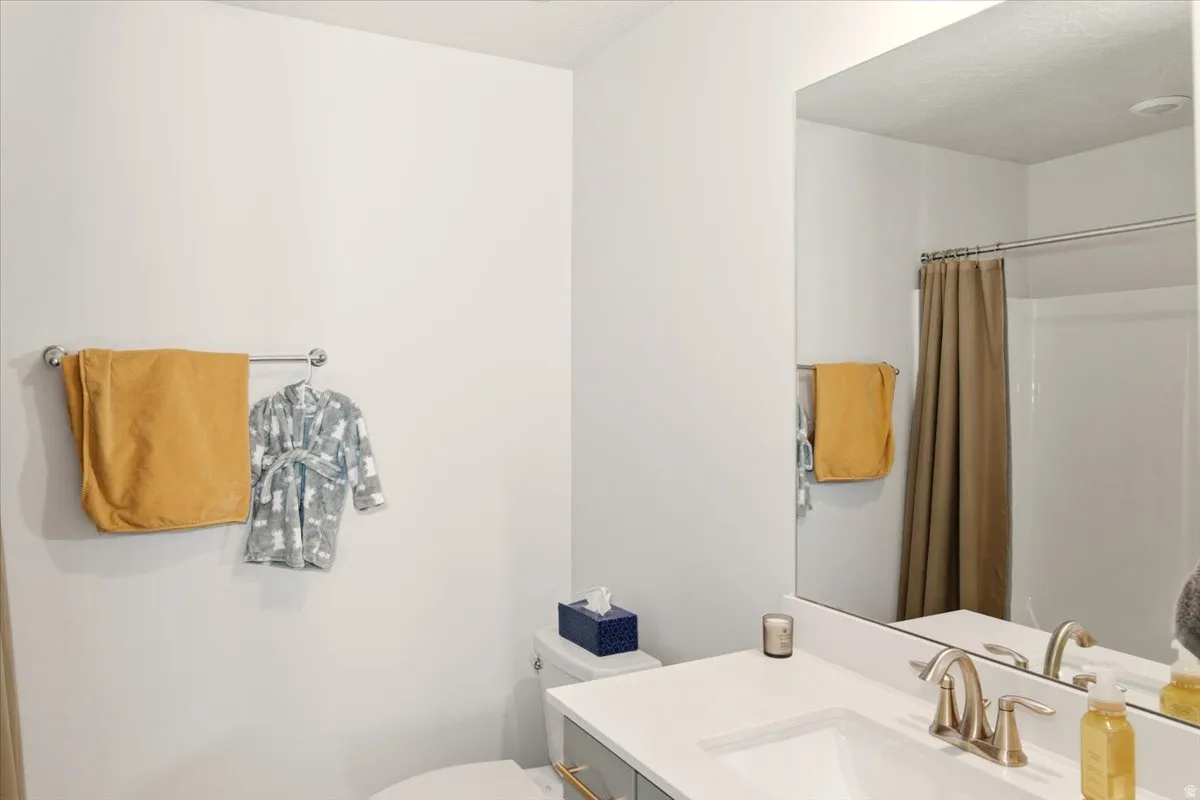 Full bathroom featuring vanity and a shower with curtain