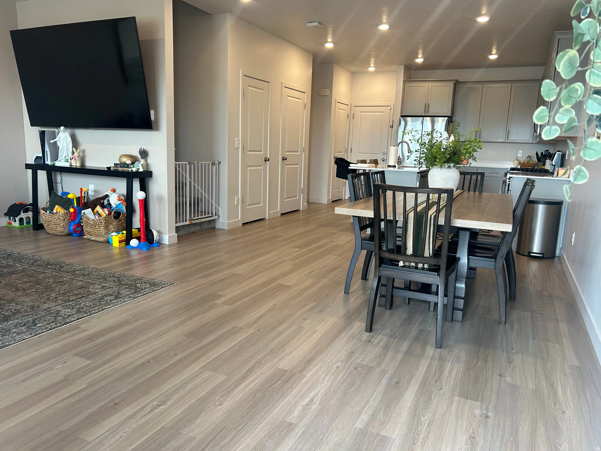 Dining area with recessed lighting and light wood finished floors