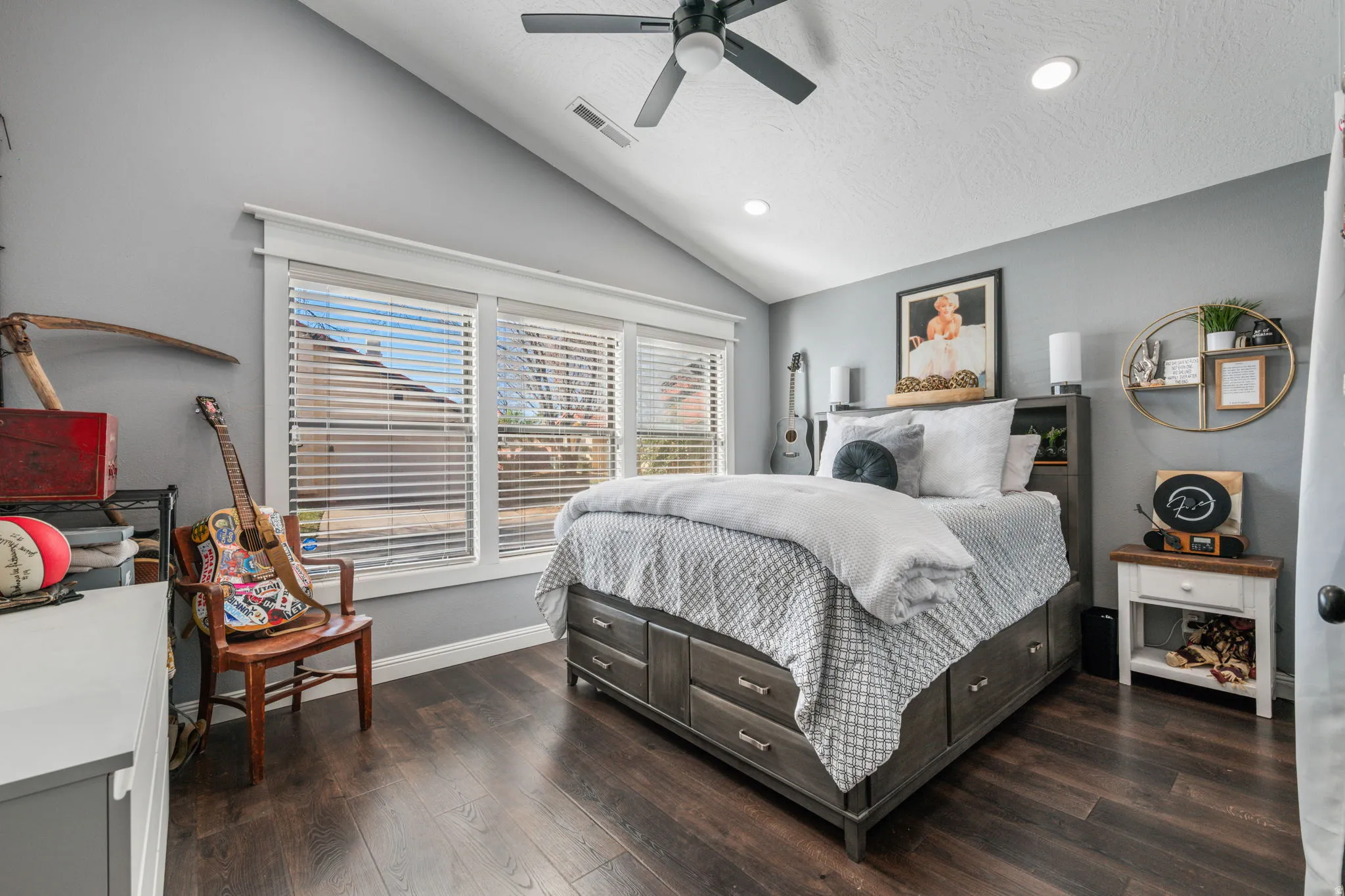 Bedroom featuring recessed lighting, dark wood-style floors, vaulted ceiling, a ceiling fan, and a textured ceiling