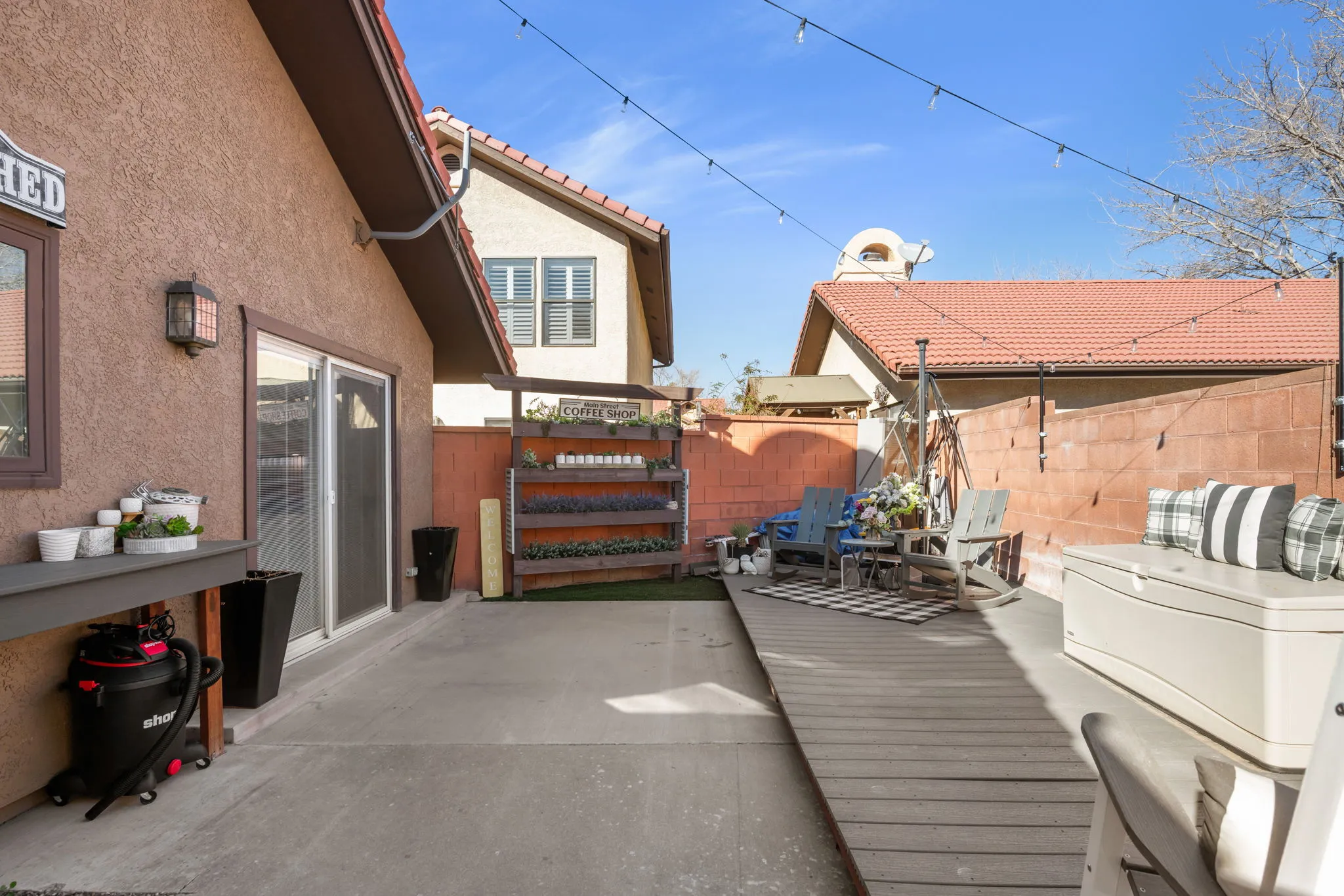 Wooden terrace with a patio area