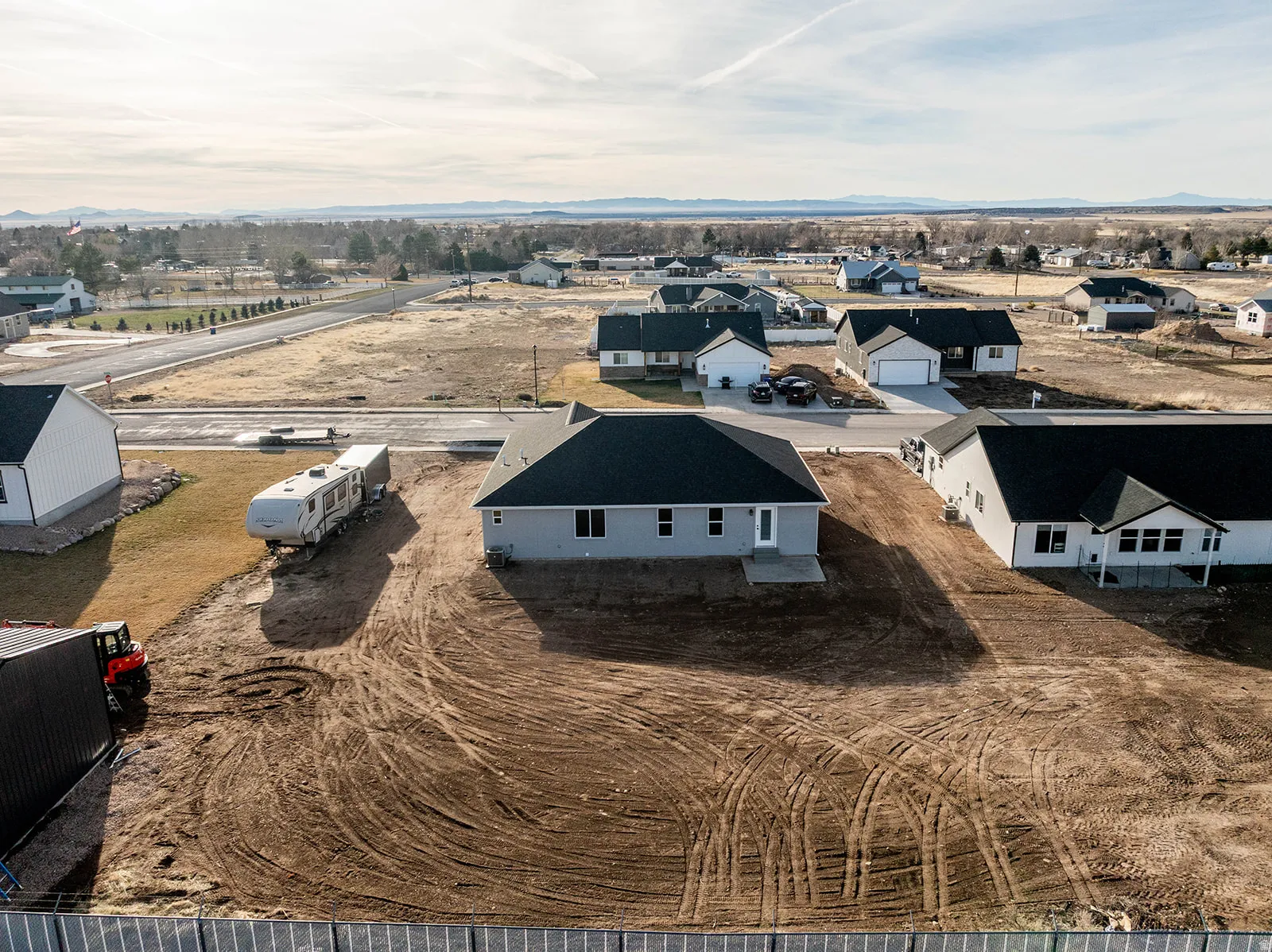Aerial view of residential area with a mountainous background