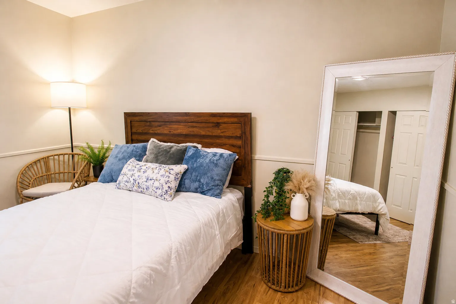 Bedroom featuring wood finished floors and a closet
