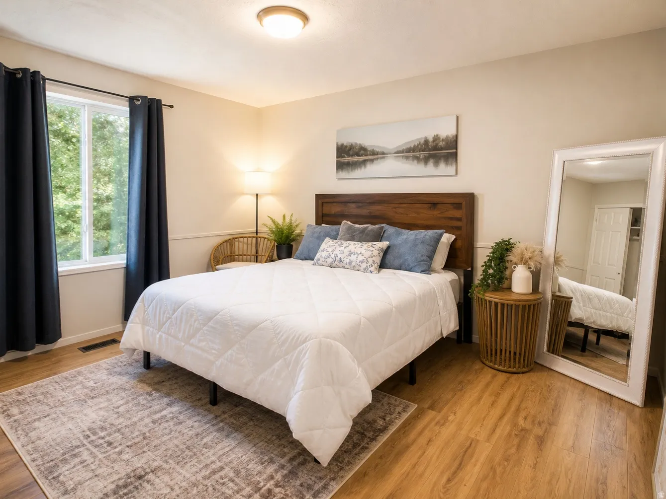 Bedroom with light wood-type flooring and baseboards