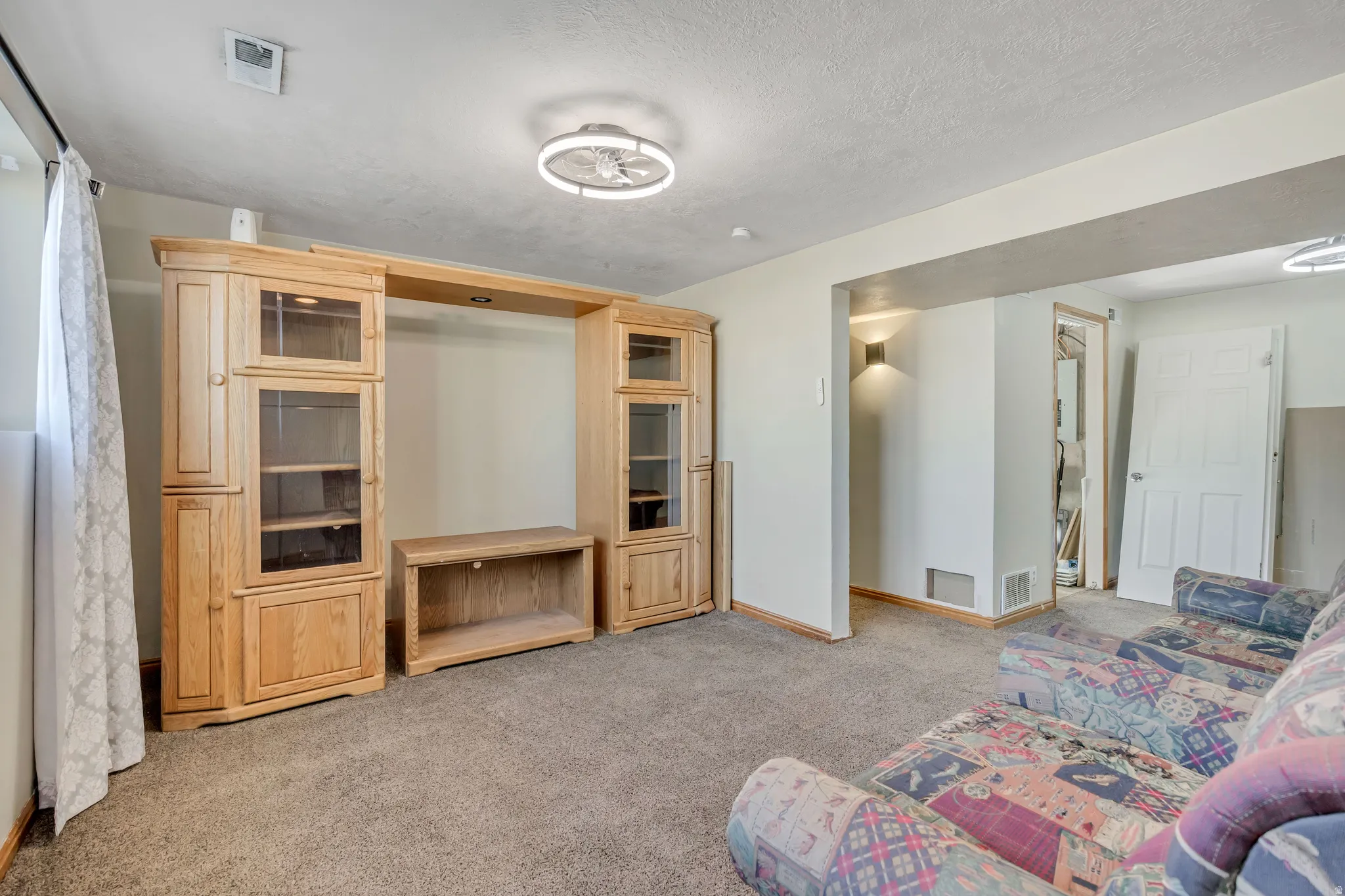 Living room with light colored carpet