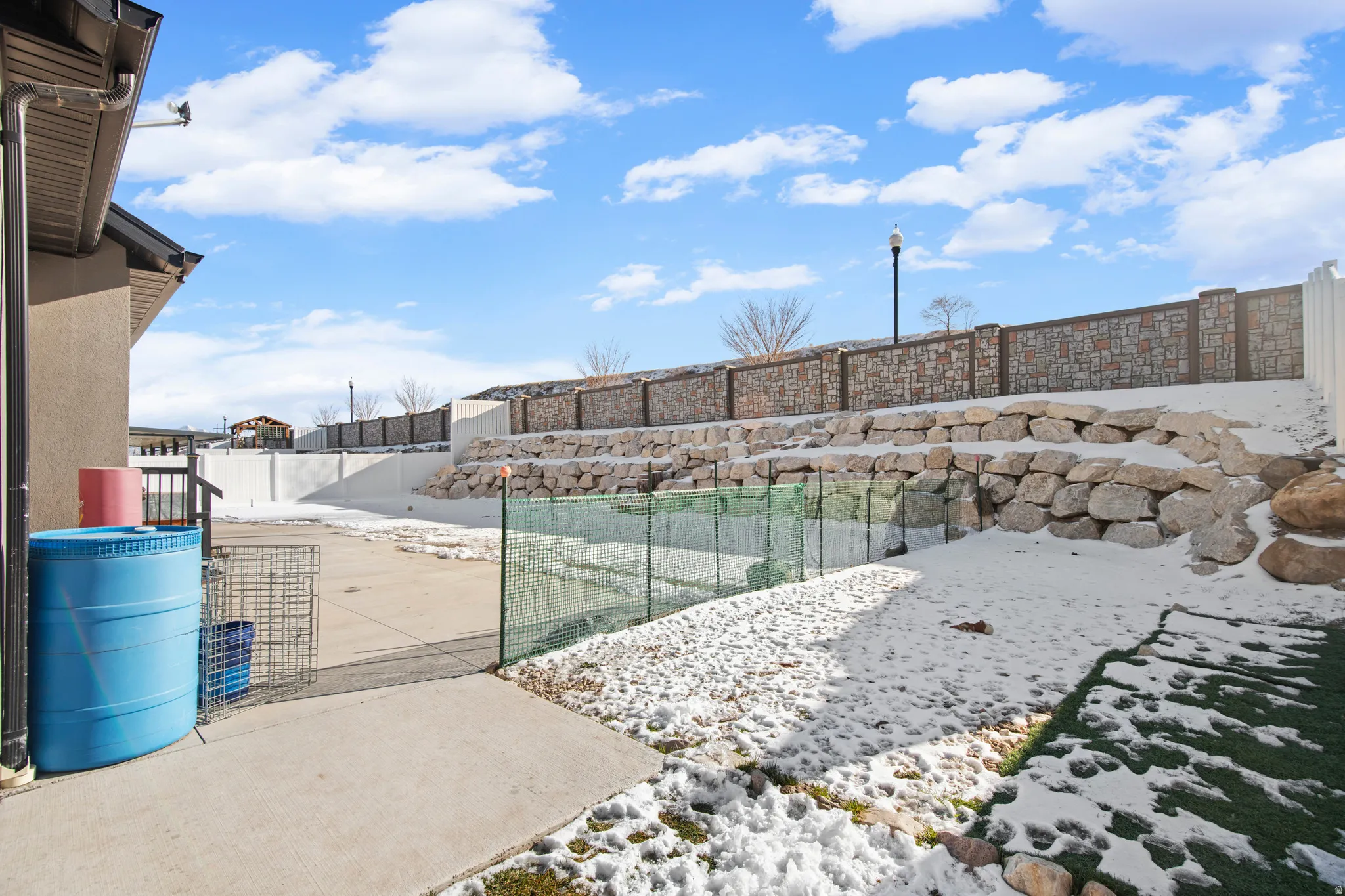 View of home's community featuring a fenced backyard and a patio area