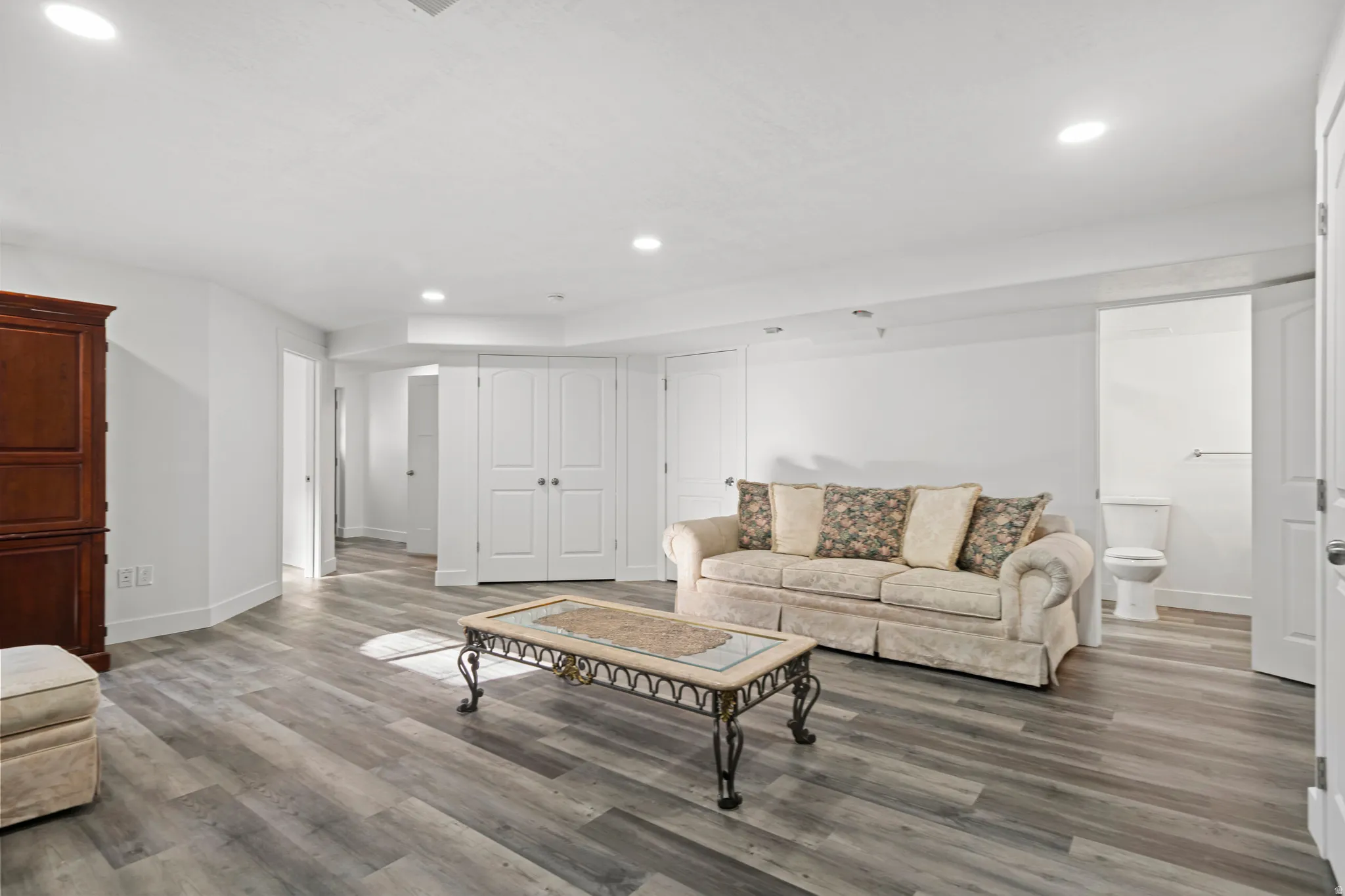 Living area with recessed lighting and wood finished floors
