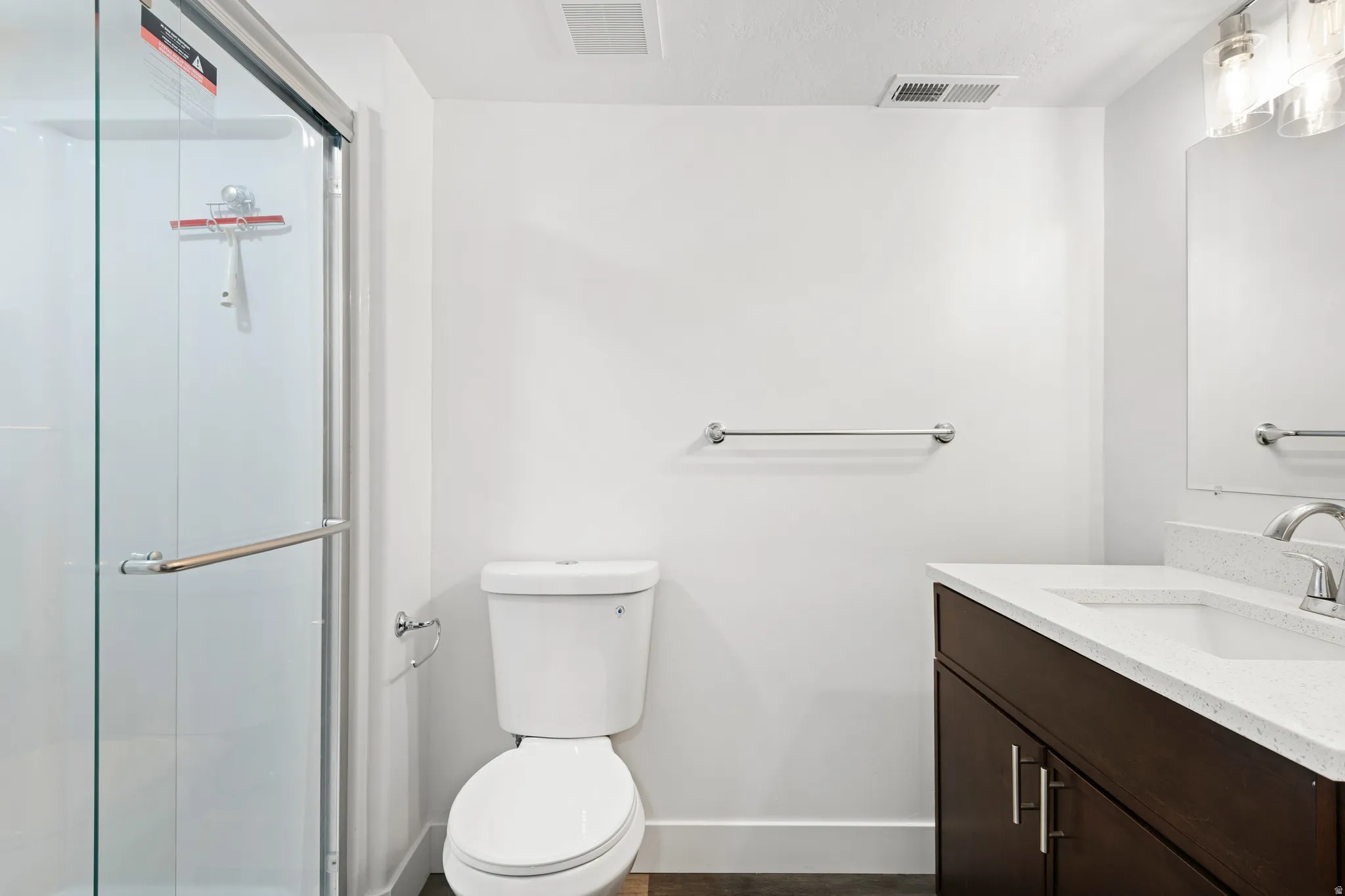 Full bathroom featuring vanity and a stall shower