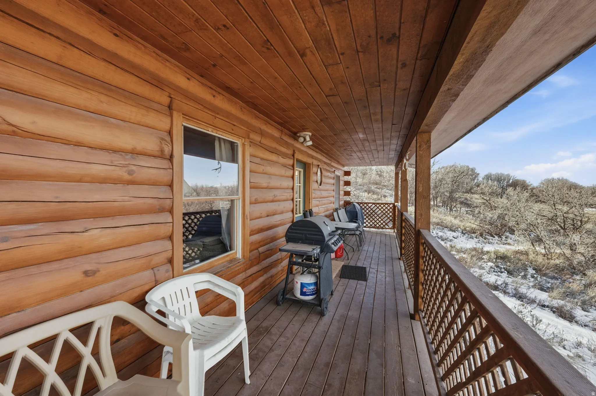 Snow covered deck with grilling area