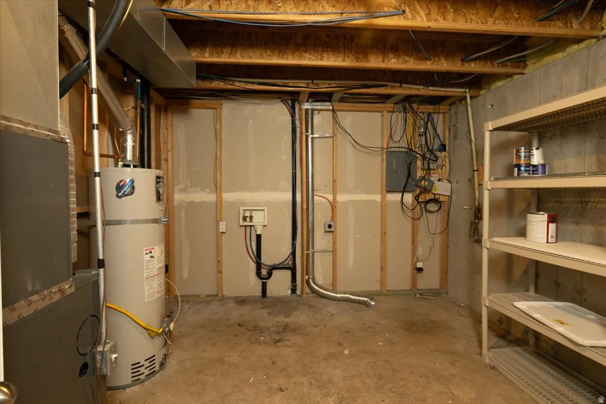 Basement utility room with washer and dryer connections