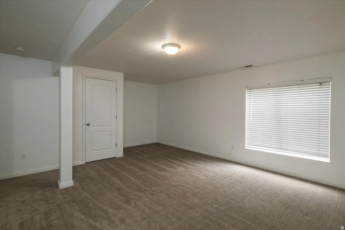Basement family room or conforming bedroom with closet and egress
