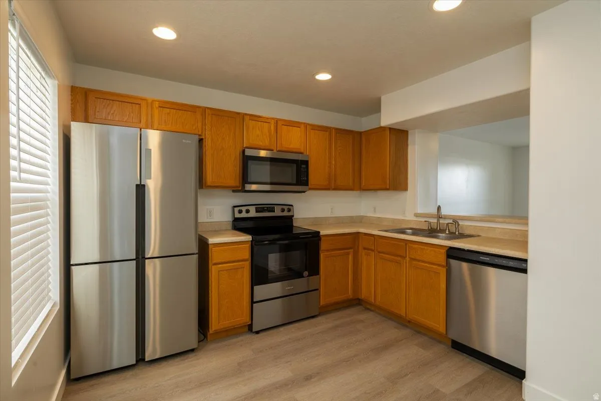 Kitchen with appliances with stainless steel finishes