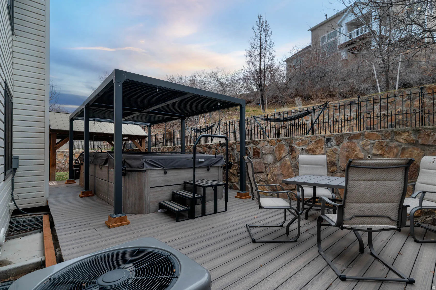 All patio furniture, swim spa, and both pergolas are included in the sale