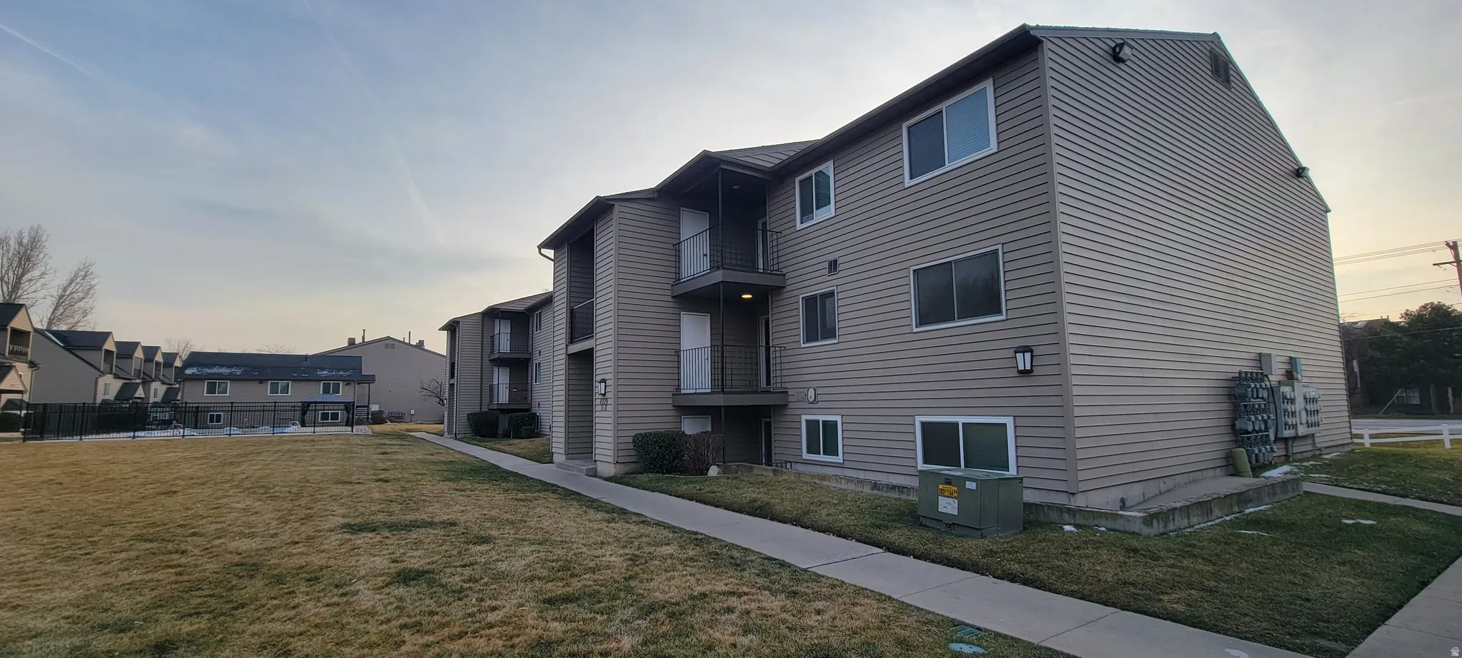 View of property exterior at dusk