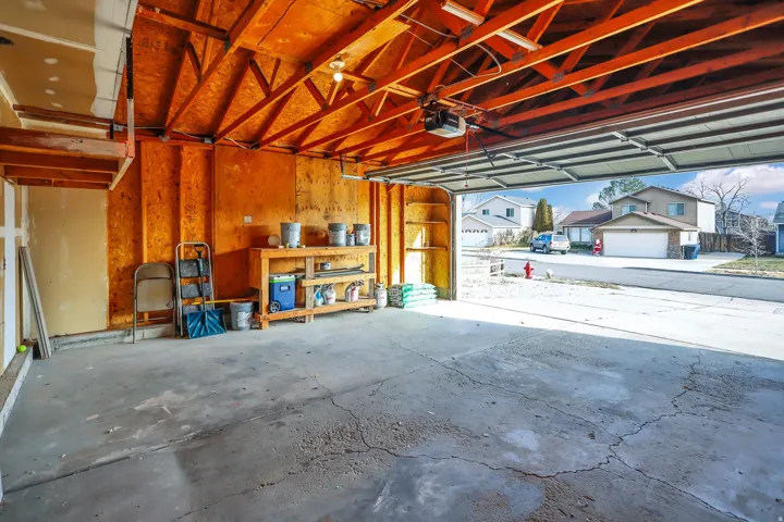 Garage featuring a garage door opener