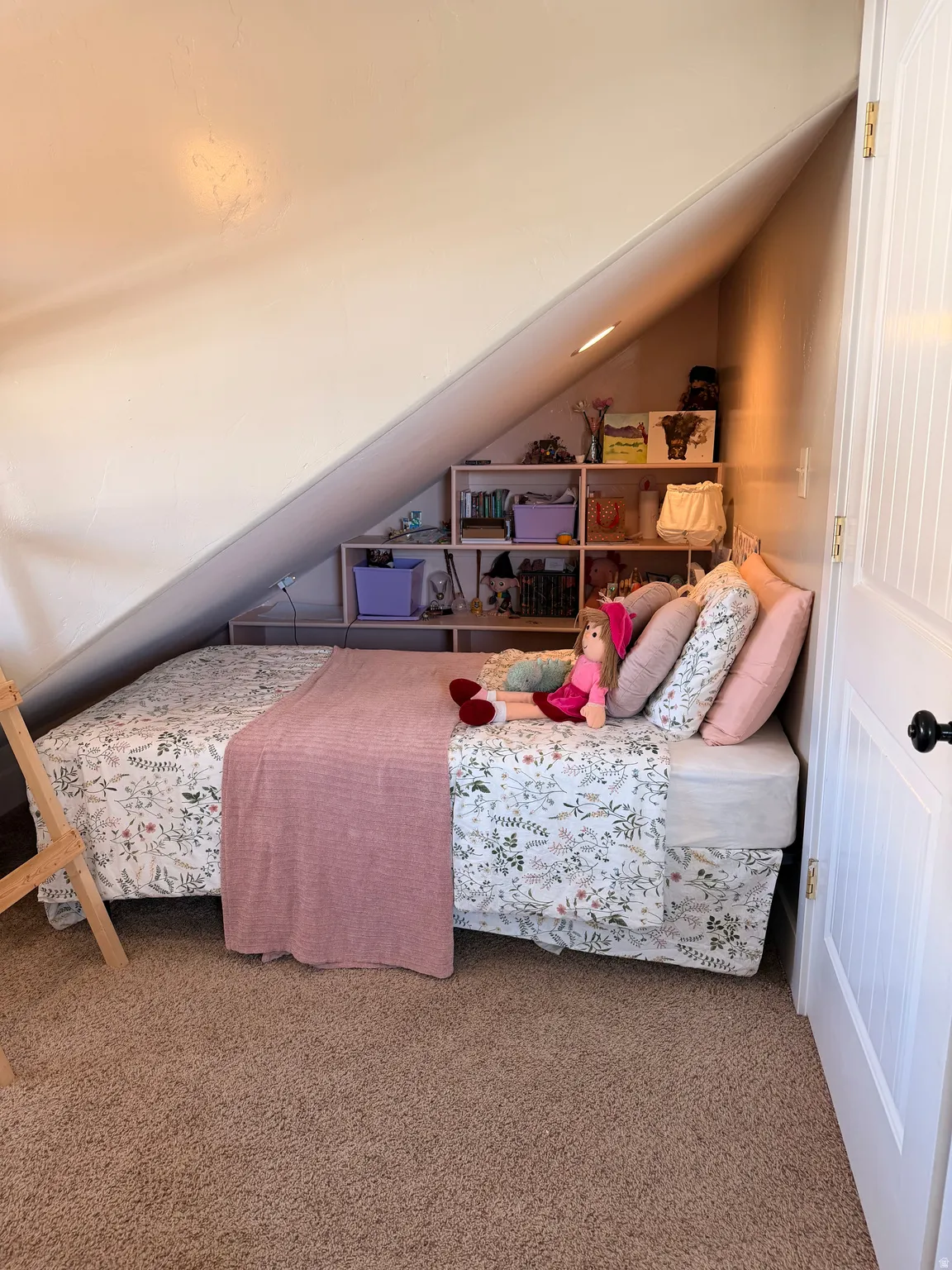 Carpeted bedroom with vaulted ceiling