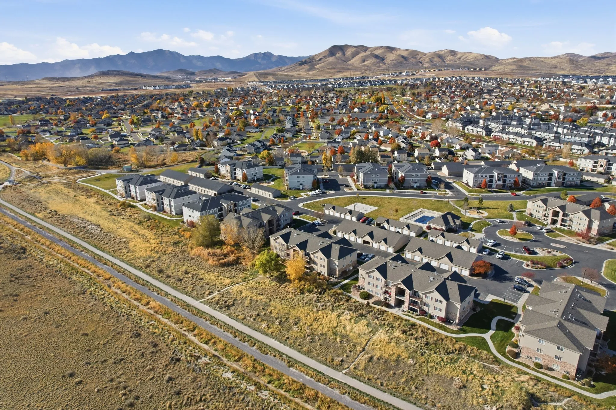 View of property location with a mountainous background and nearby suburban area