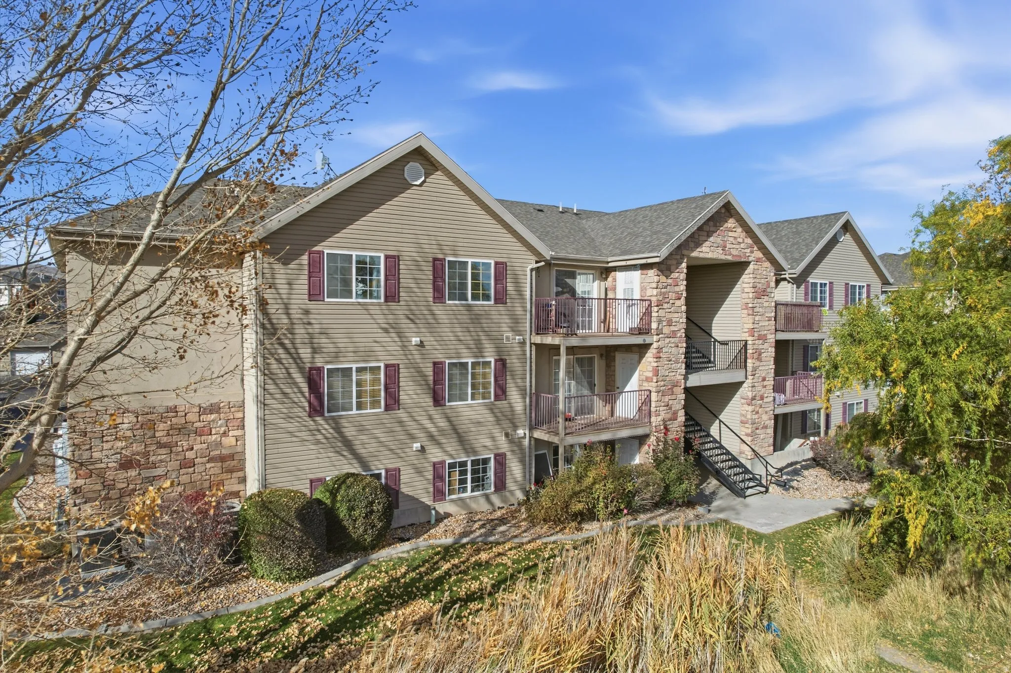 View of apartment building / complex with stairs