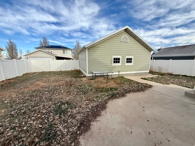 View of property exterior with a fenced backyard