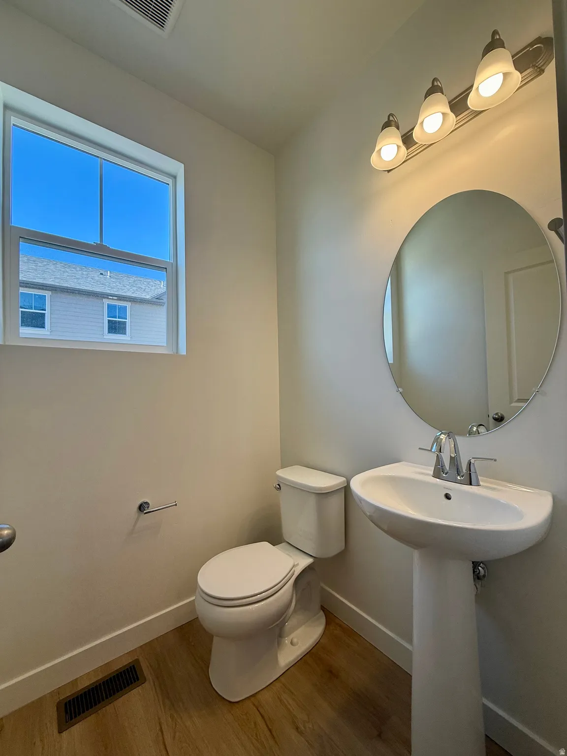 Bathroom featuring wood finished floors