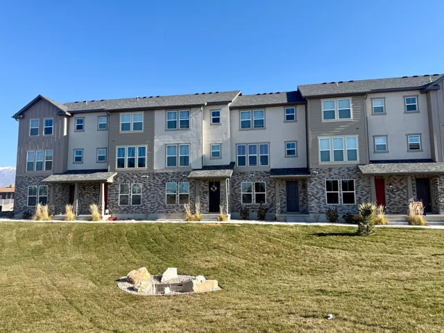 Rear view of house with a lawn