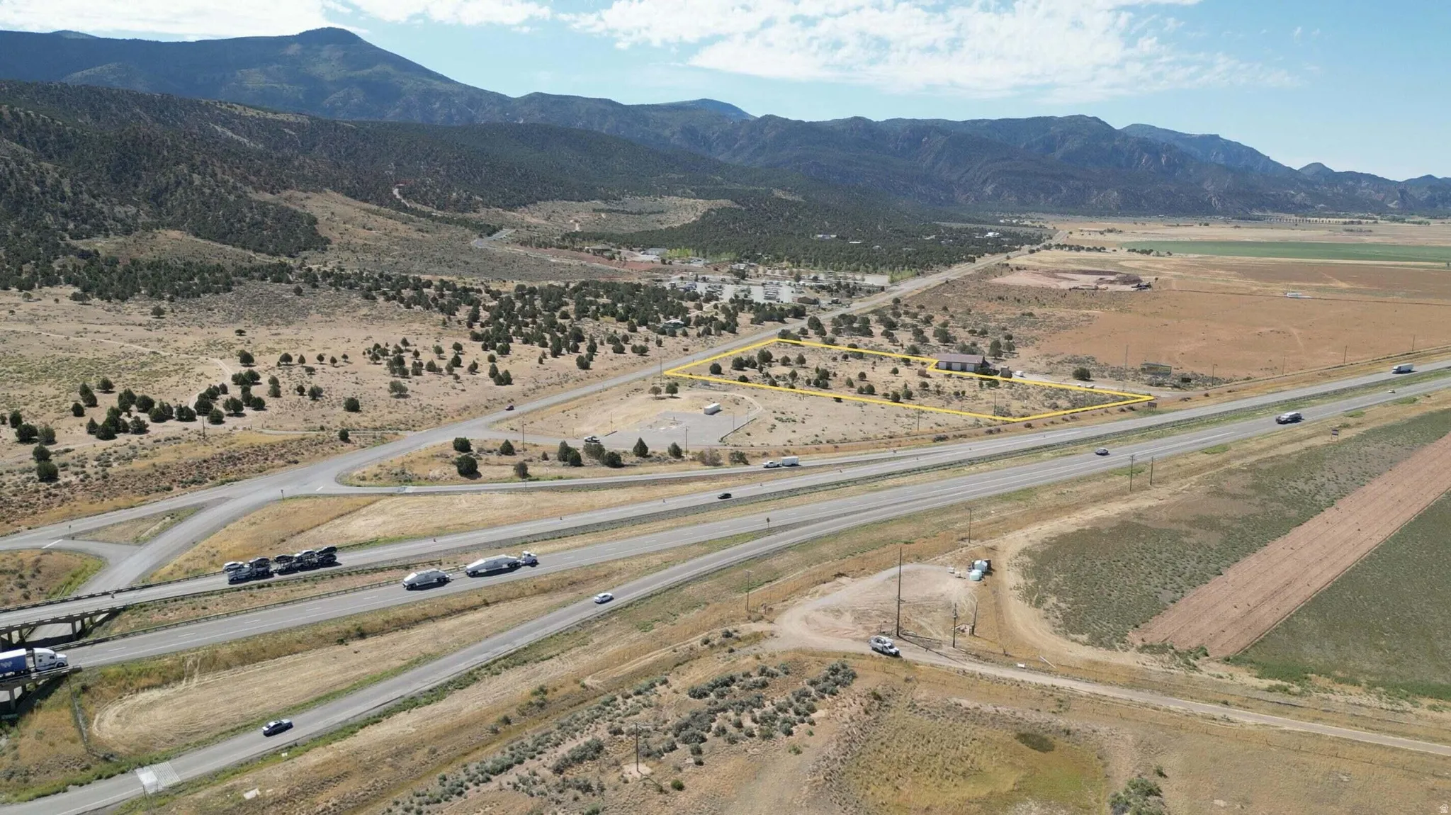 Aerial view of sparsely populated area with a mountain backdrop