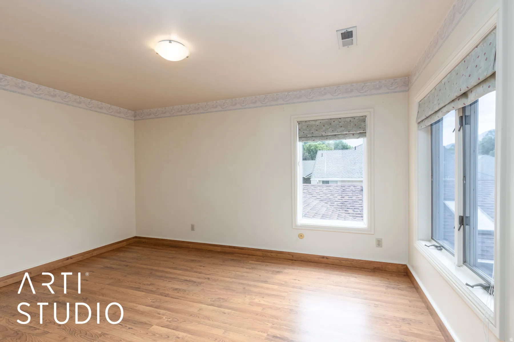 Unfurnished room featuring light wood-type flooring and baseboards