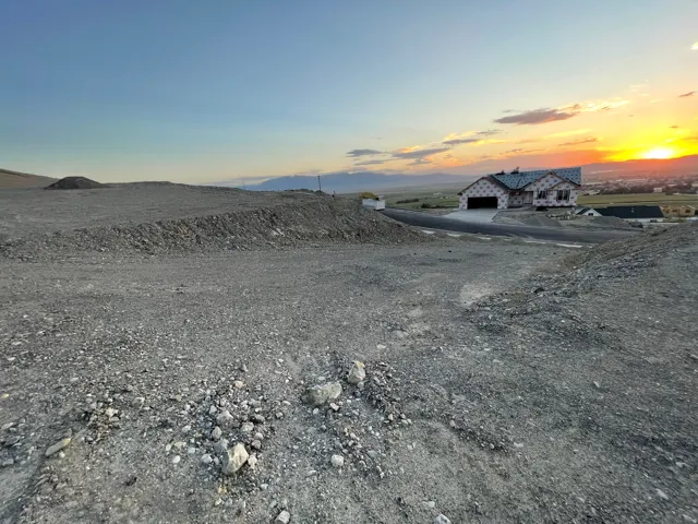 View of dirt / gravel road featuring a mountain view